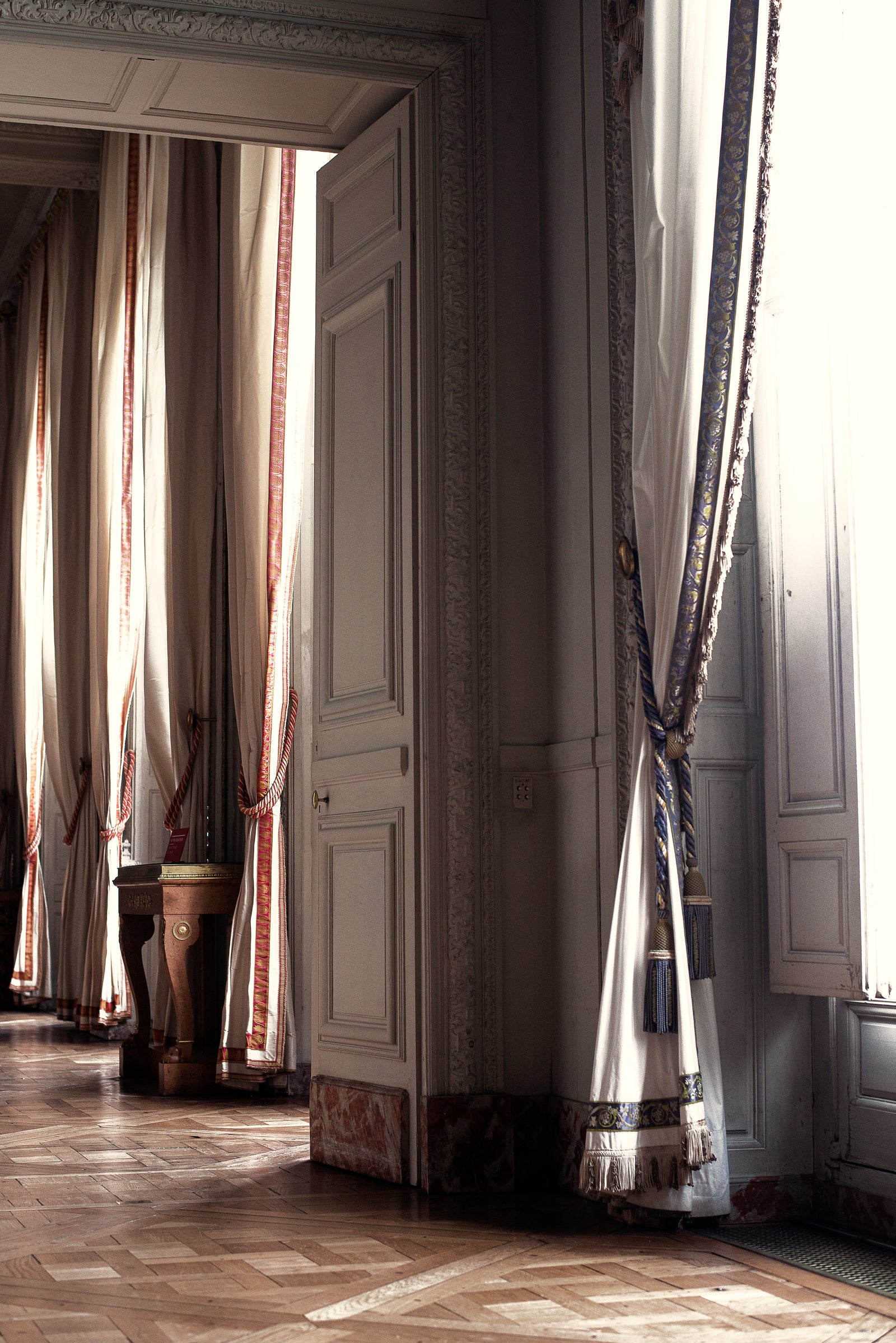 Full-length made-up curtain panels at tall windows